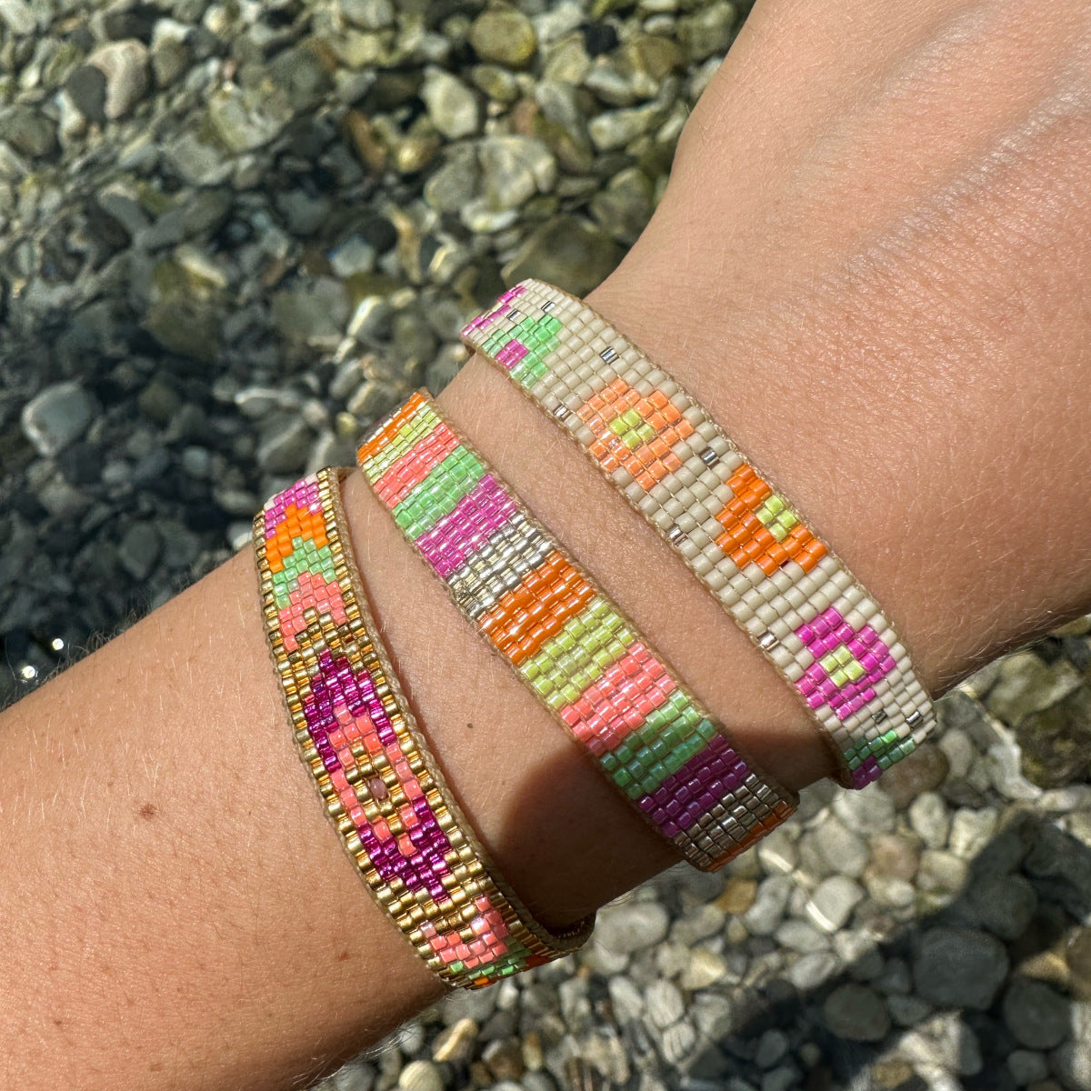 This stunning adjustable bracelet is handwoven by our team of master artisans using Japanese  glass beads in neon tones.  Wear yours stacked or solo to add a mood-boosting pop of color to any neutral look!  Details:      Japanese glass beads     Handwoven adjustable bracelet     Width11mm     Can be worn in the water